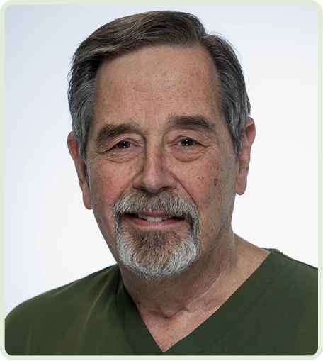 Smiling man in medical scrubs