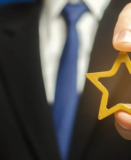 bigstock-Man-Holds-A-Golden-Star-In-His-357753359_1